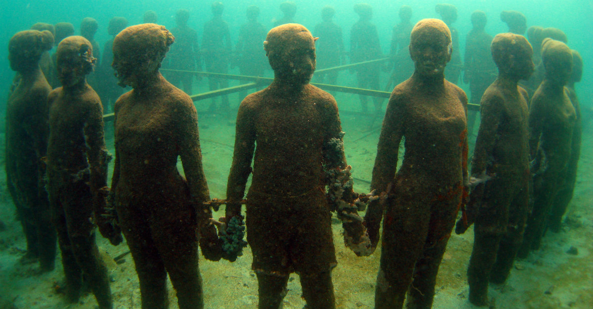 Statues in an underwater sculpture park.